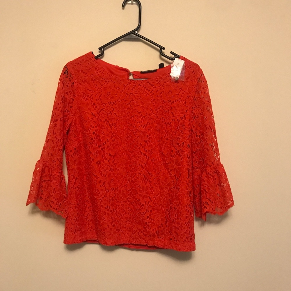Red top with ruffled sleeves